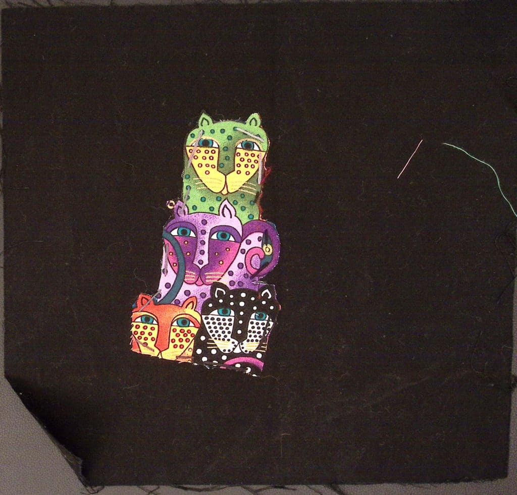 Black square with colorful jaguars