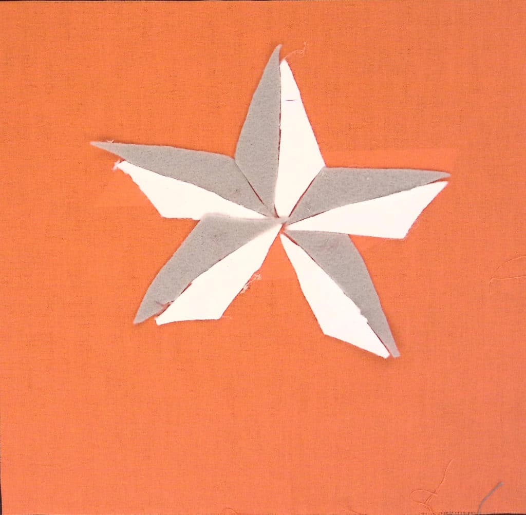 Gray and white star on an orange background.