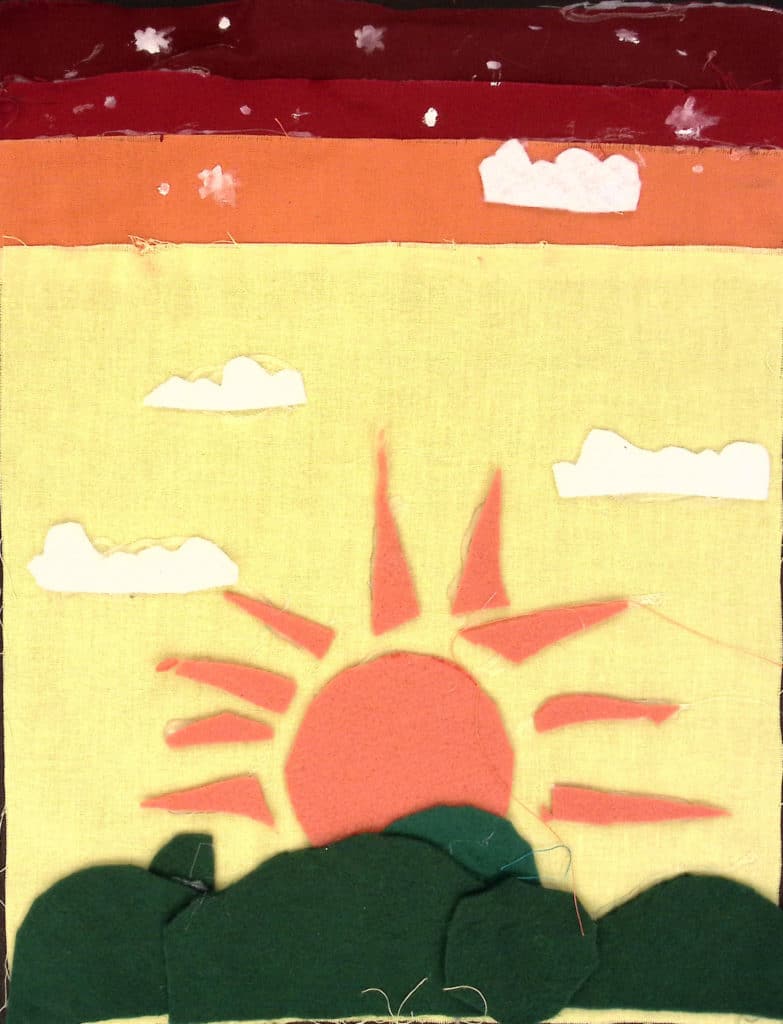 Sun and h ills on yellow, orange and red background