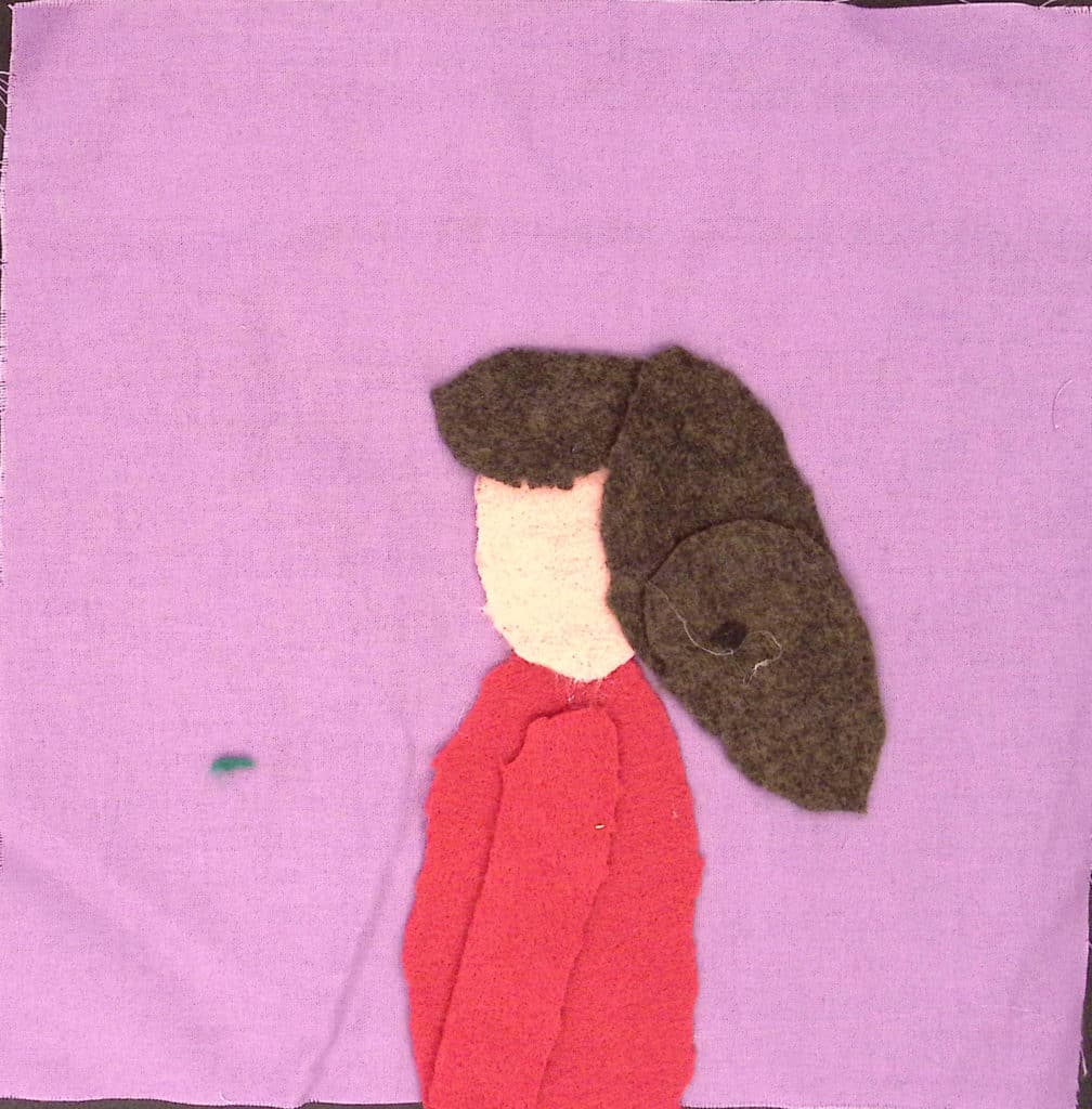 A person in profile wearing a red shirt on a purple background