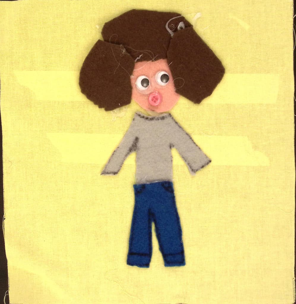 A person with a gray shirt, brown hair and a pink button for a mouth on a yellow background