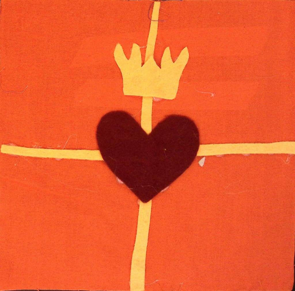 A yellow cross on an orange background, with a red heart in the middle and a yellow crown.