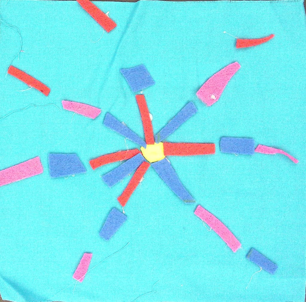 Blue square with a purple, red and blue starburst