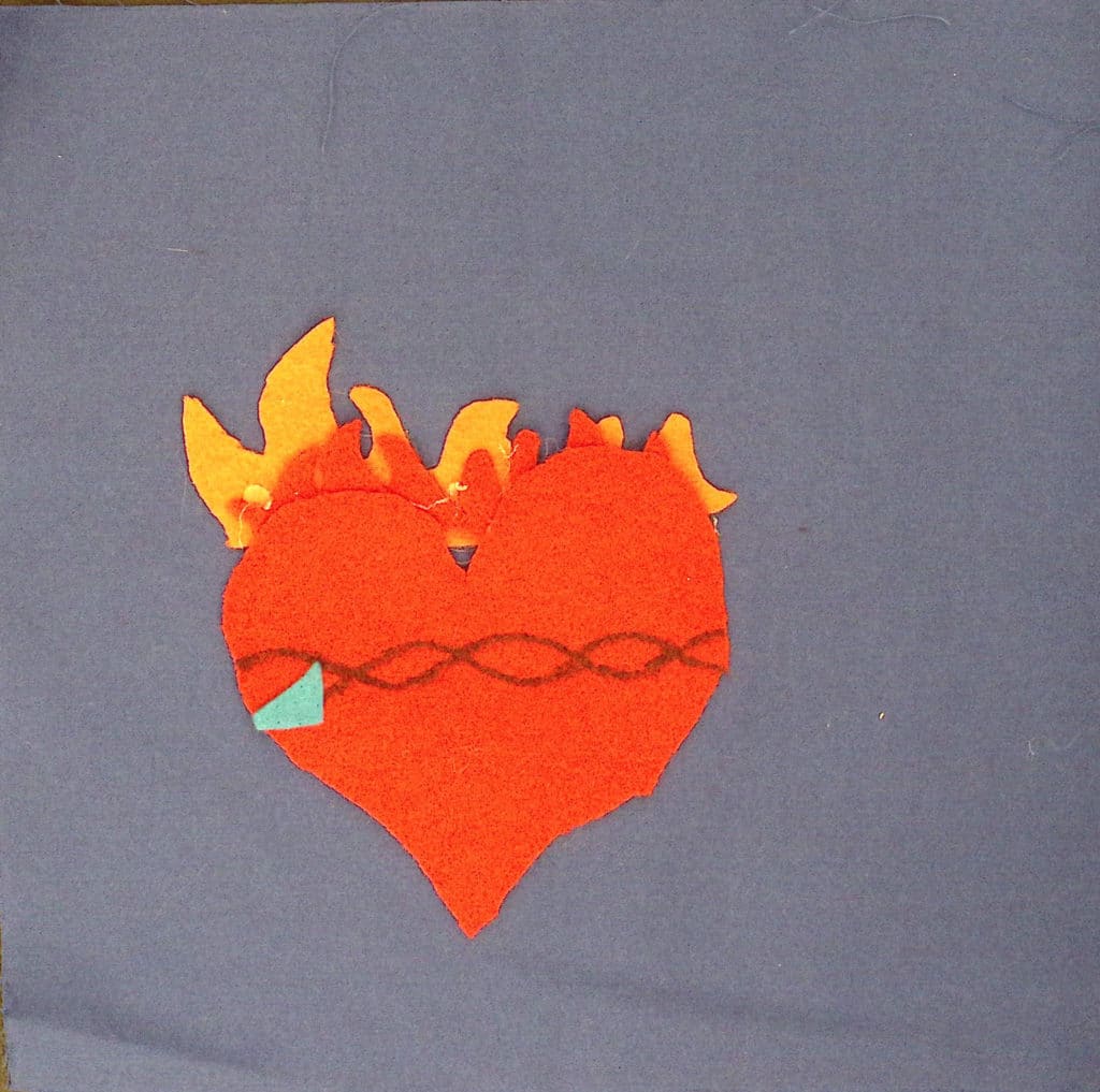 An orange flaming heart with a chain across it on a gray-blue background.