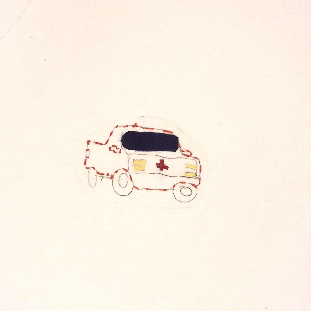 Embroidered emergency vehicle on white background