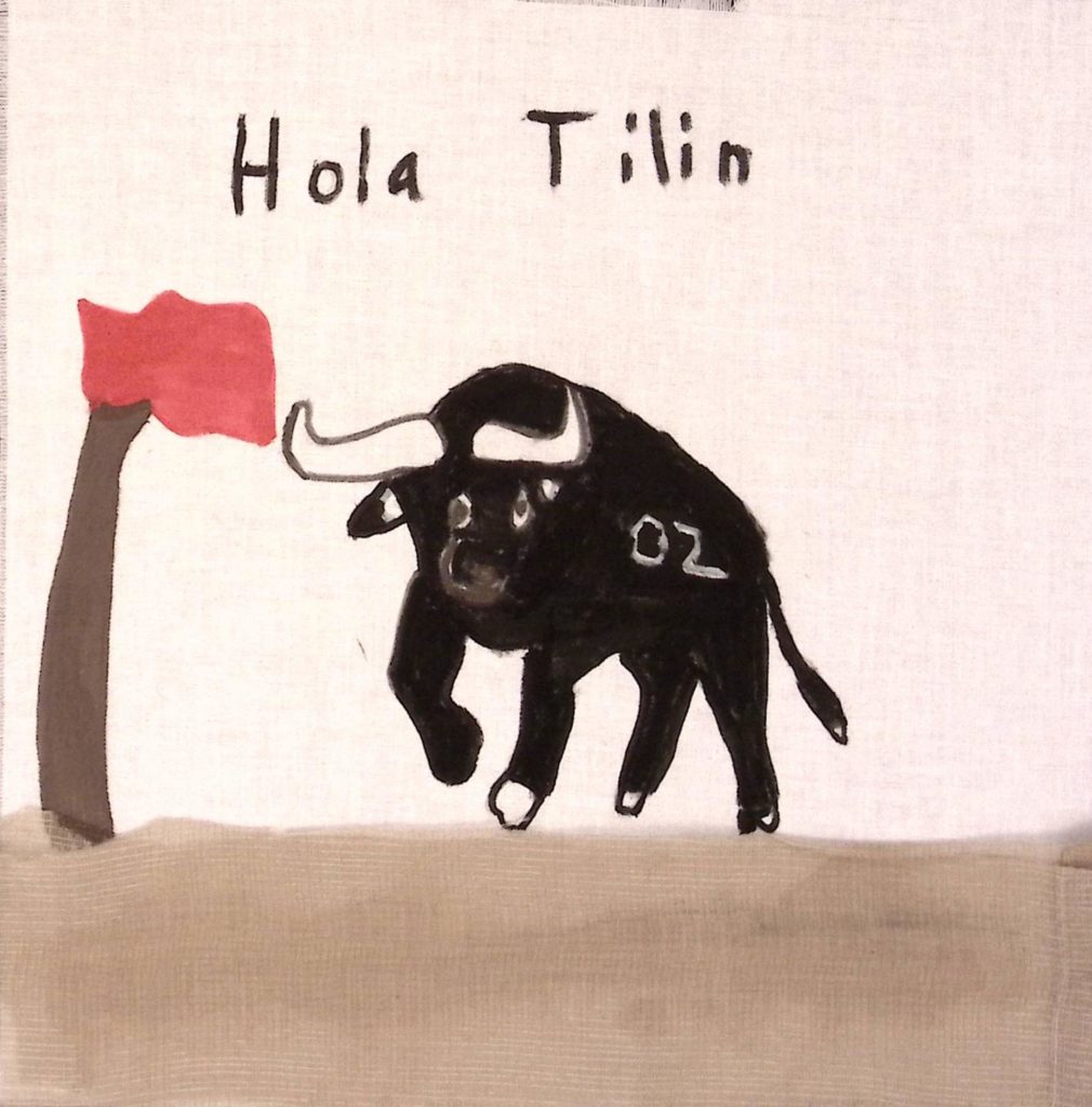 A large black bull with white horns and a white "02" on its side, running toward a red flag. Text above reads, "Hola Tilin."
