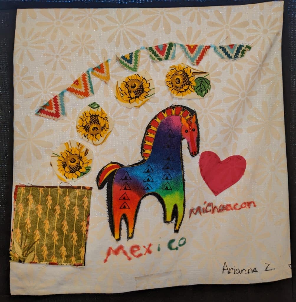 Colorful horse with sunflowers, colorful banners, and a heart, with the word "Michoacan."