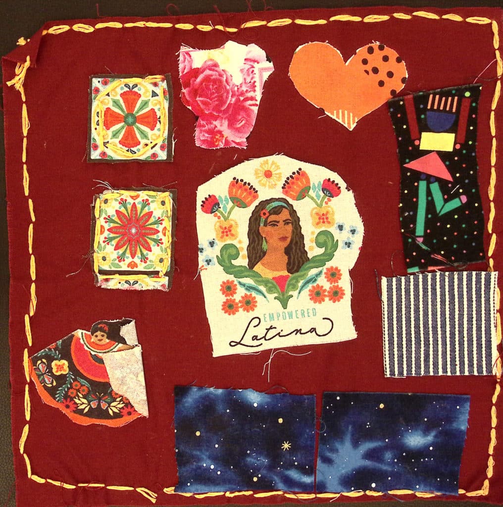 A red square with an orange stitched border, a portrait of a Latina woman with the words "empowered Latina," and traditional designs