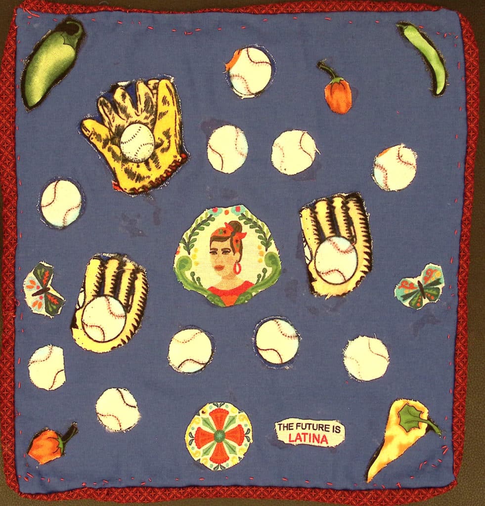 A blue square with a red border, with baseball gloves and baseballs, chili peppers, and a portrait of a woman in the center.