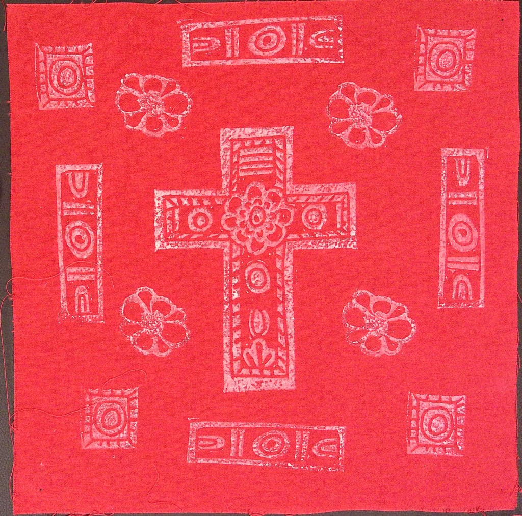 Red square with white cross, flowers and patterns.