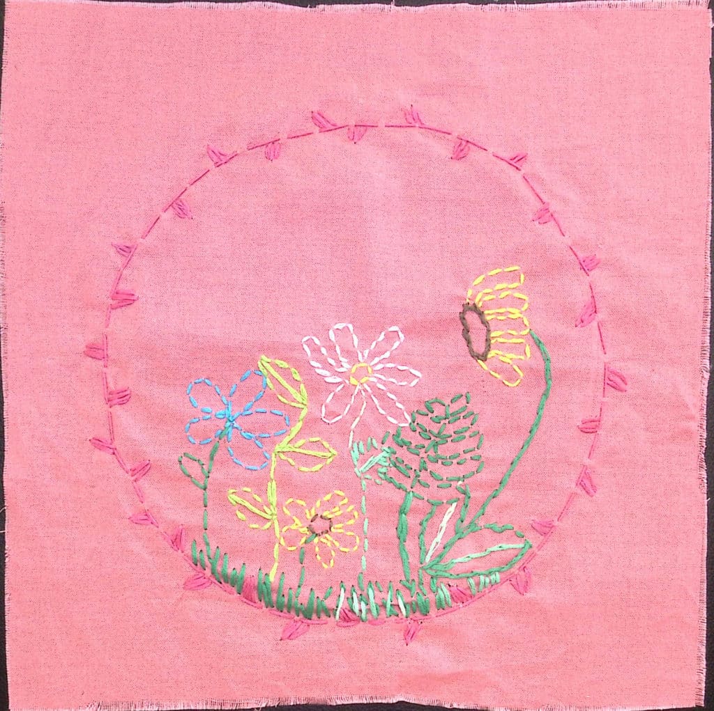 Embroidered flowers on a pink background