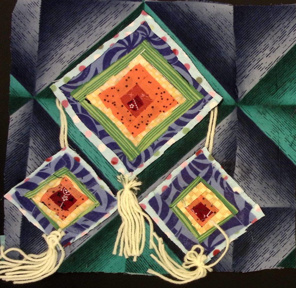 Colorful Ojos de Dio or Eyes of God with yarn tassels