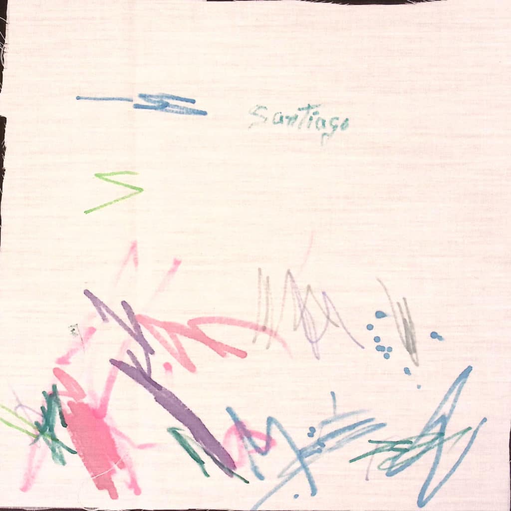 A white square with drawings in colorful marker.