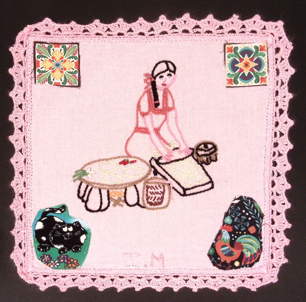 Pink border, embroidered girl rolling out dough