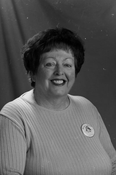 Photograph of Molly Banz, wearing a pin for her organization, Molly's Angels of Napa County.