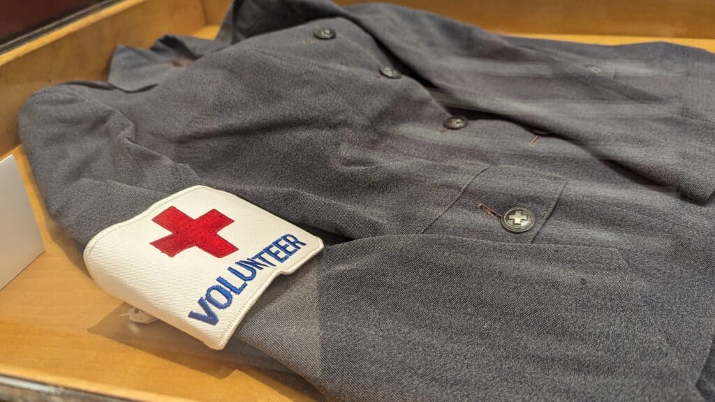 Detail of a woman's Red Cross volunteer uniform, circa 1940s.