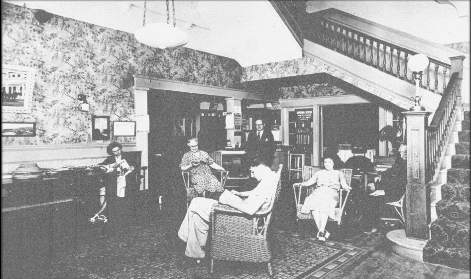 Men and women relax in chairs in a lobby area of the Calistoga hotel.