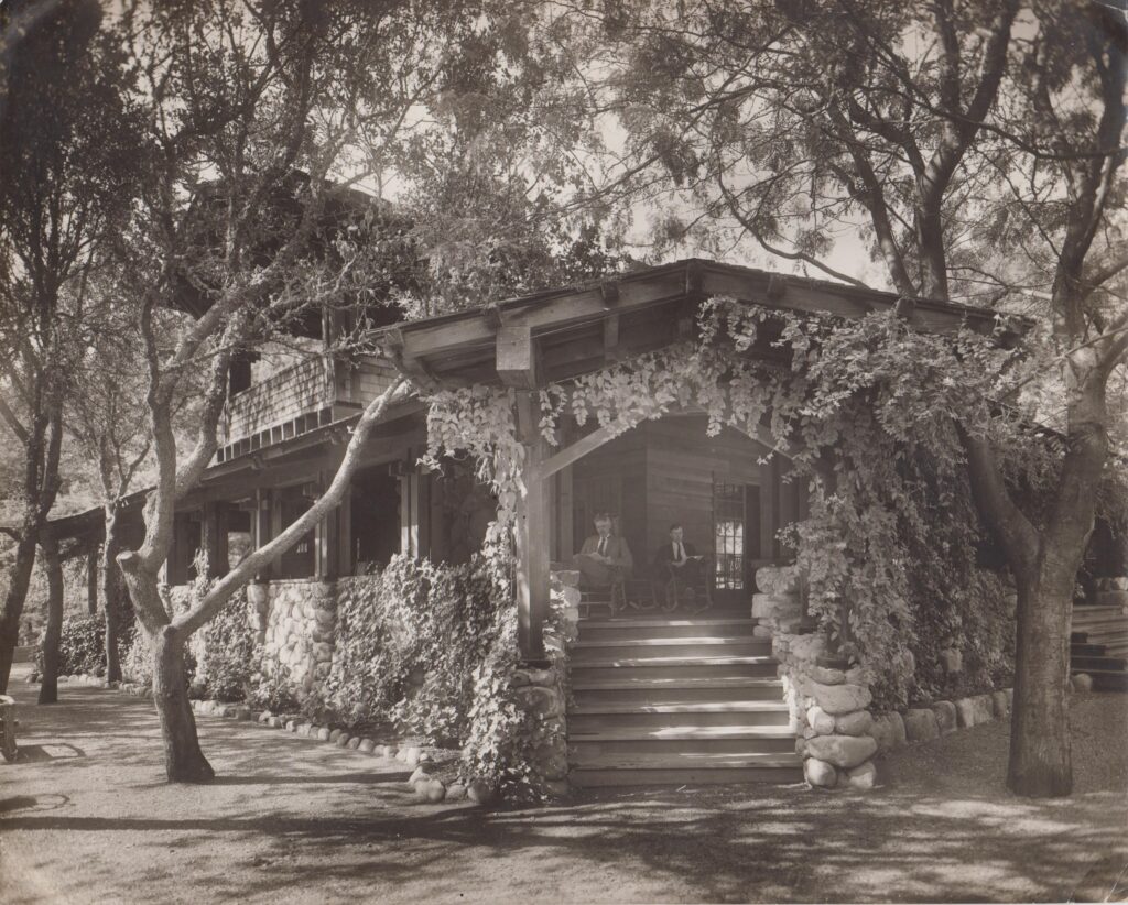 A man reads on the porch of a cabin at Aetna Springs.