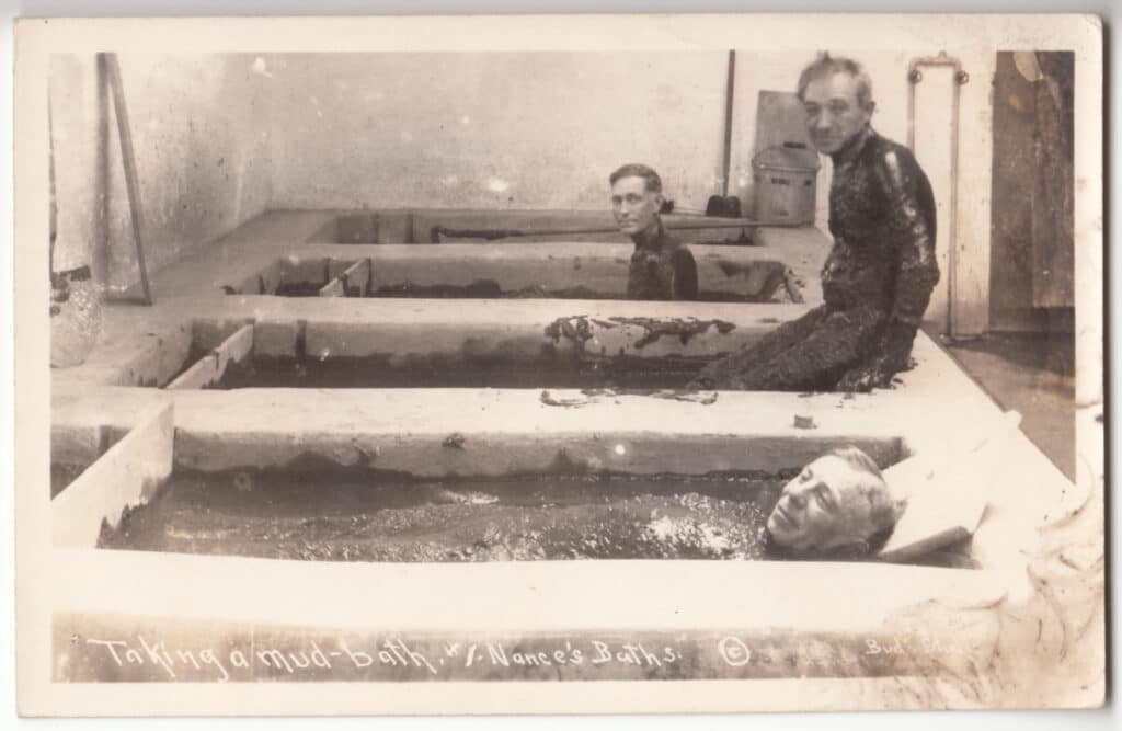 Men in the mudbaths at Nance's Mudbaths.