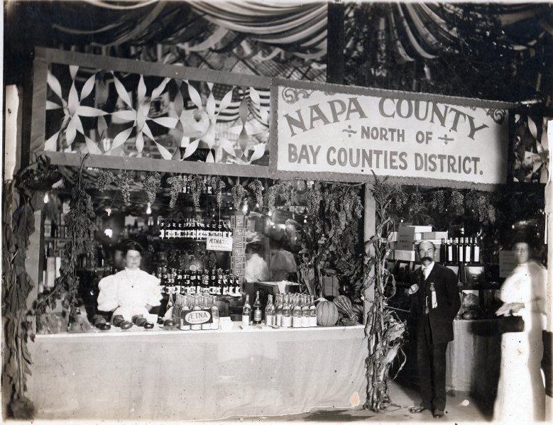 A booth at the State Fair for Napa County showcasing mineral waters, food products.