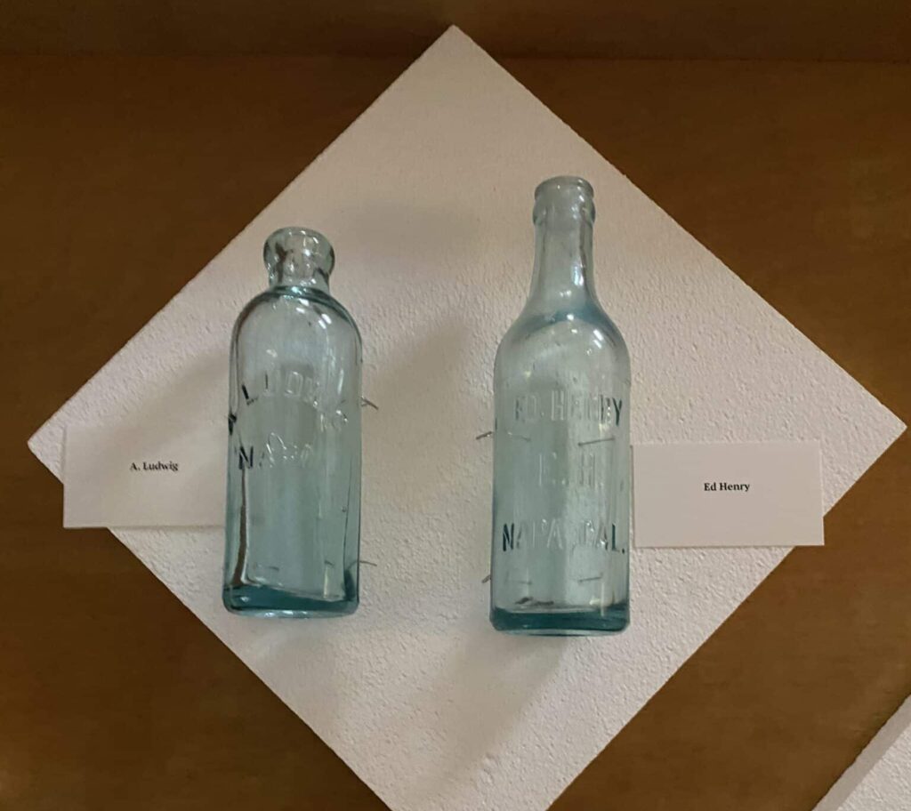 Two bottles in light blue glass, for two sellers in Napa County