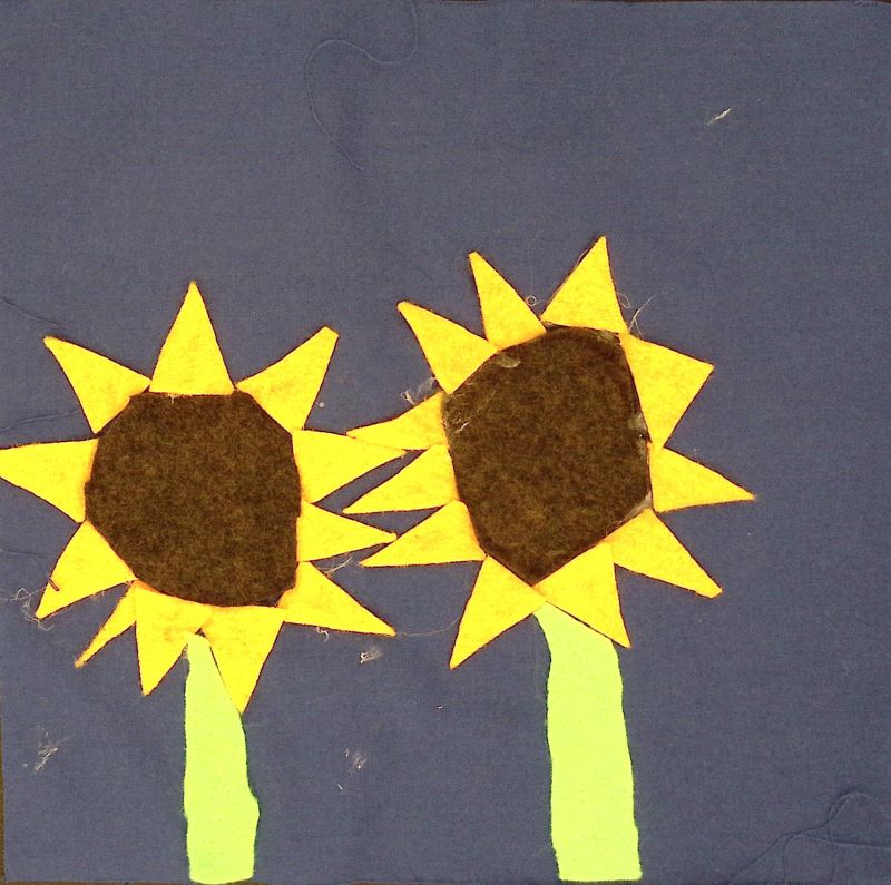 yellow and brown sunflowers on a blue background