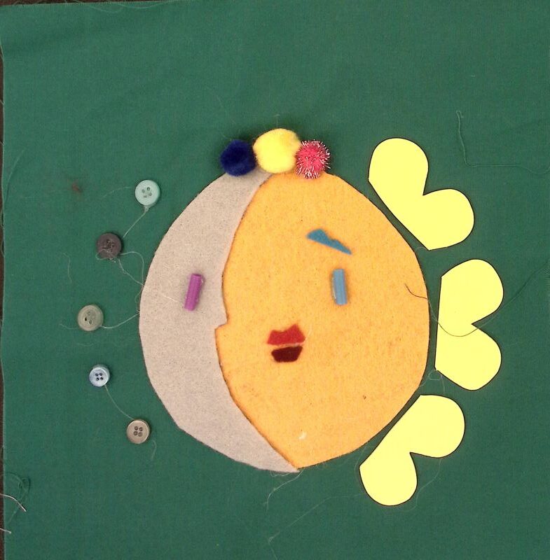 Dark green square with a combined moon and sun. Small blue buttons surround the gray moon and yellow rays surround the yellow sun.
